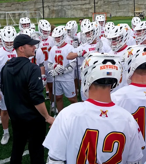 COACH PURPURA team huddle